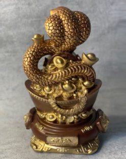 змея на золотом слитке финансовый успех